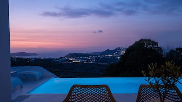 Outdoor pool, a heated pool, sun loungers