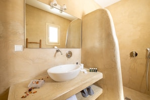 Bathtub, eco-friendly toiletries, hair dryer, towels