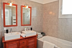 Combined shower/tub, hair dryer, towels, soap