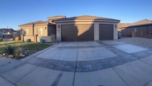 A residential driveway leading to a garage with a number 2761 garage door. - Sand Hollow Retreat (Hurricane)