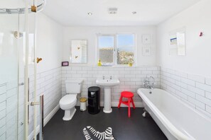 Shower, hair dryer, towels, toilet paper