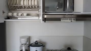 Microwave, coffee/tea maker, cookware/dishes/utensils, paper towels