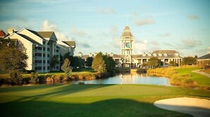 Surrounded by lush greenery, this tranquil setting offers a serene golf course experience.