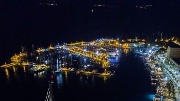An aerial view of a marina with multiple yachts docked, a large cruise ship, and well-lit waterfront buildings. - Holiday Home Aspalathos, 2 BDR Apt, Close To All Tourist Attractions 		 (Split)