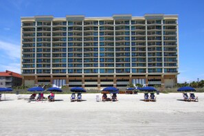 On the beach, sun-loungers, beach towels