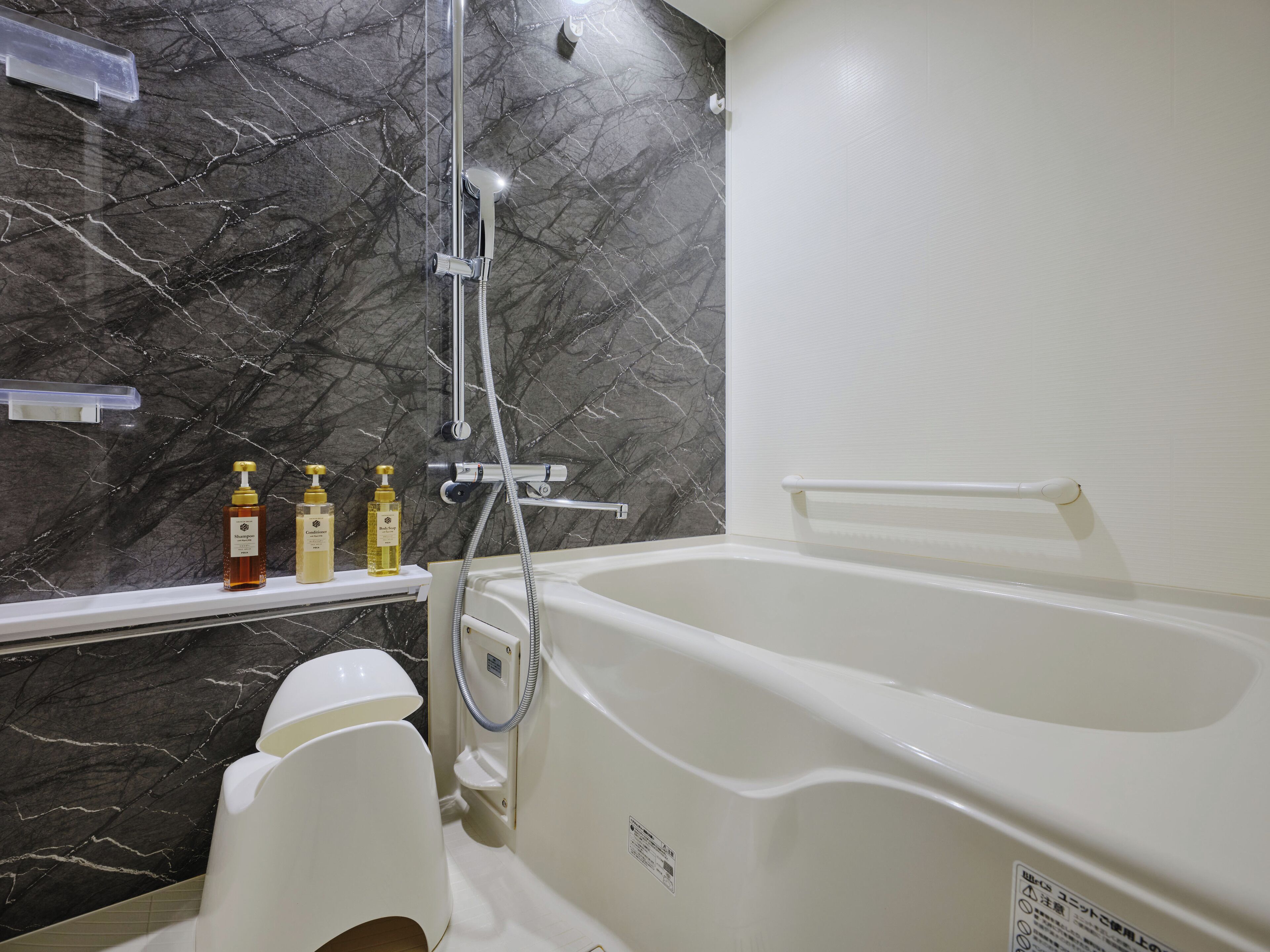 Separate tub and shower, hair dryer, slippers, electronic bidet