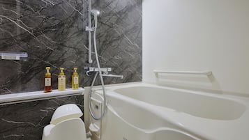 Separate tub and shower, hair dryer, slippers, electronic bidet