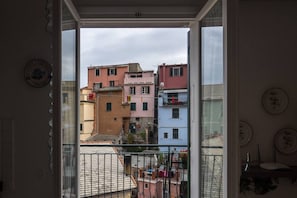 Relax on the balcony with a view of the surrounding residential area.