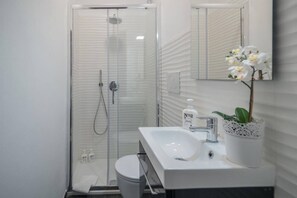 Shower, eco-friendly toiletries, hair dryer, bidet