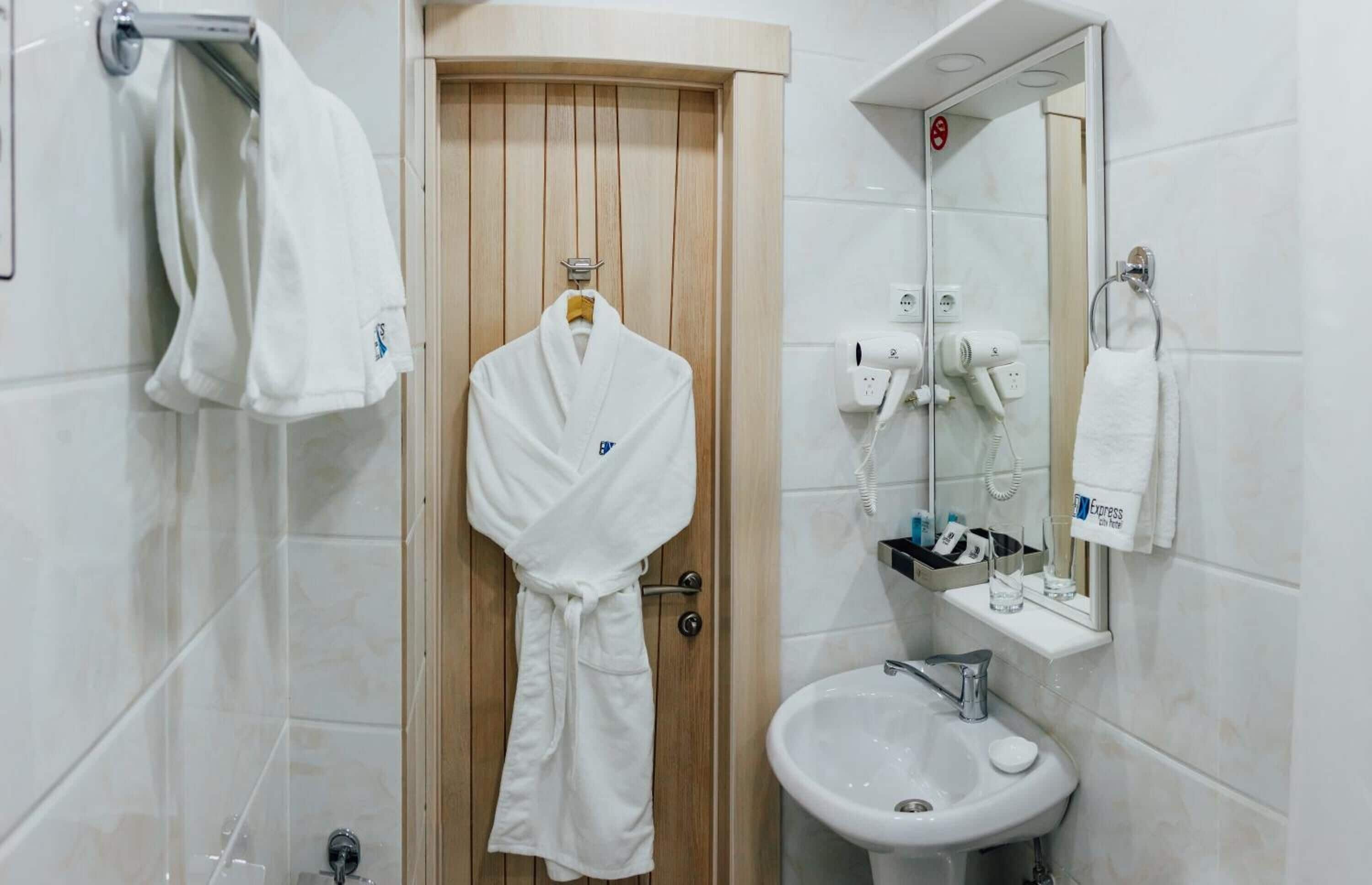 shower, hair dryer, bathrobes, slippers