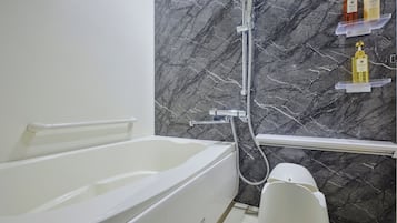 Separate tub and shower, hair dryer, slippers, electronic bidet