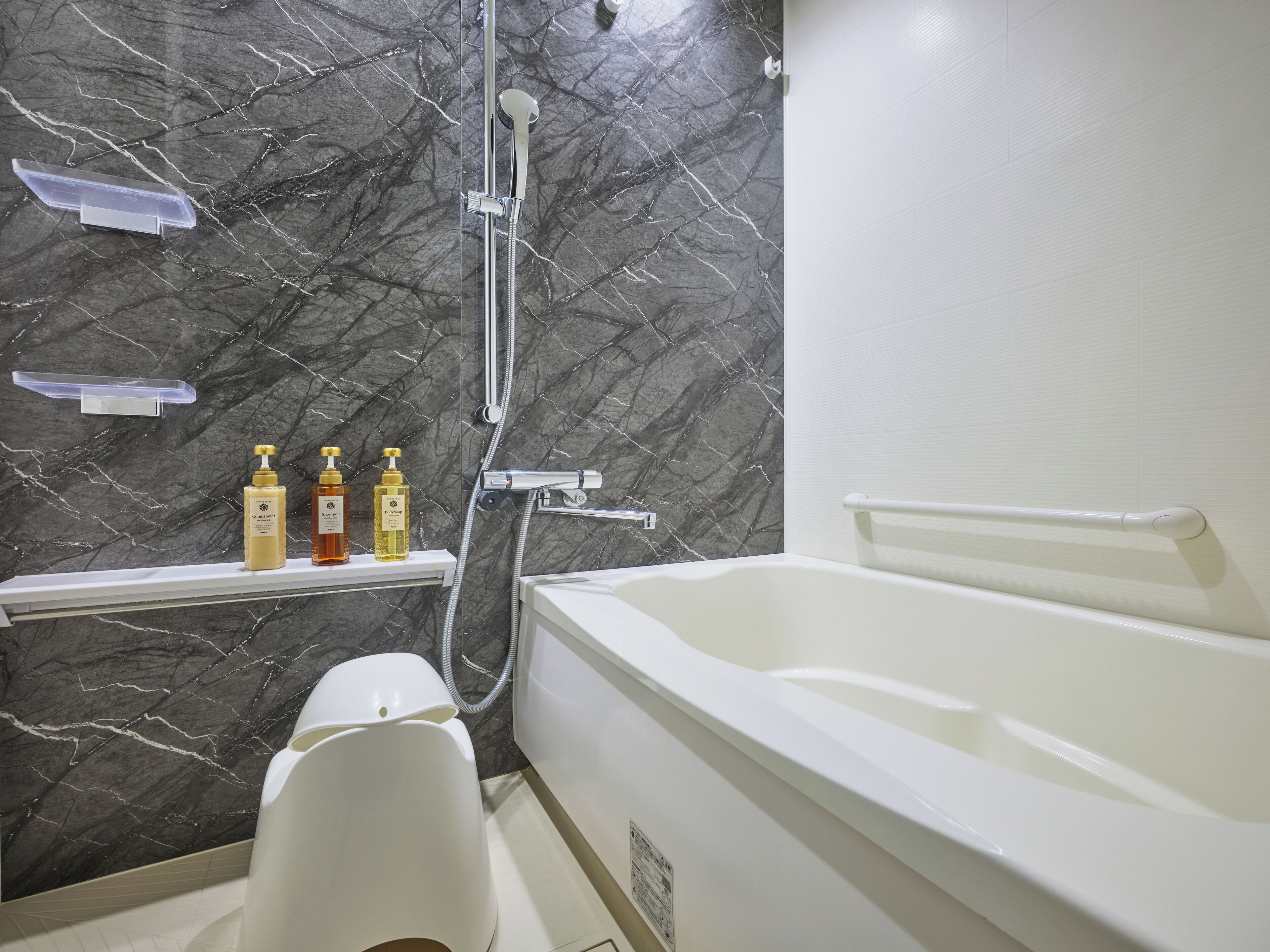 Separate tub and shower, hair dryer, slippers, electronic bidet