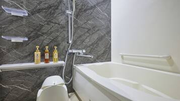 Separate tub and shower, hair dryer, slippers, electronic bidet