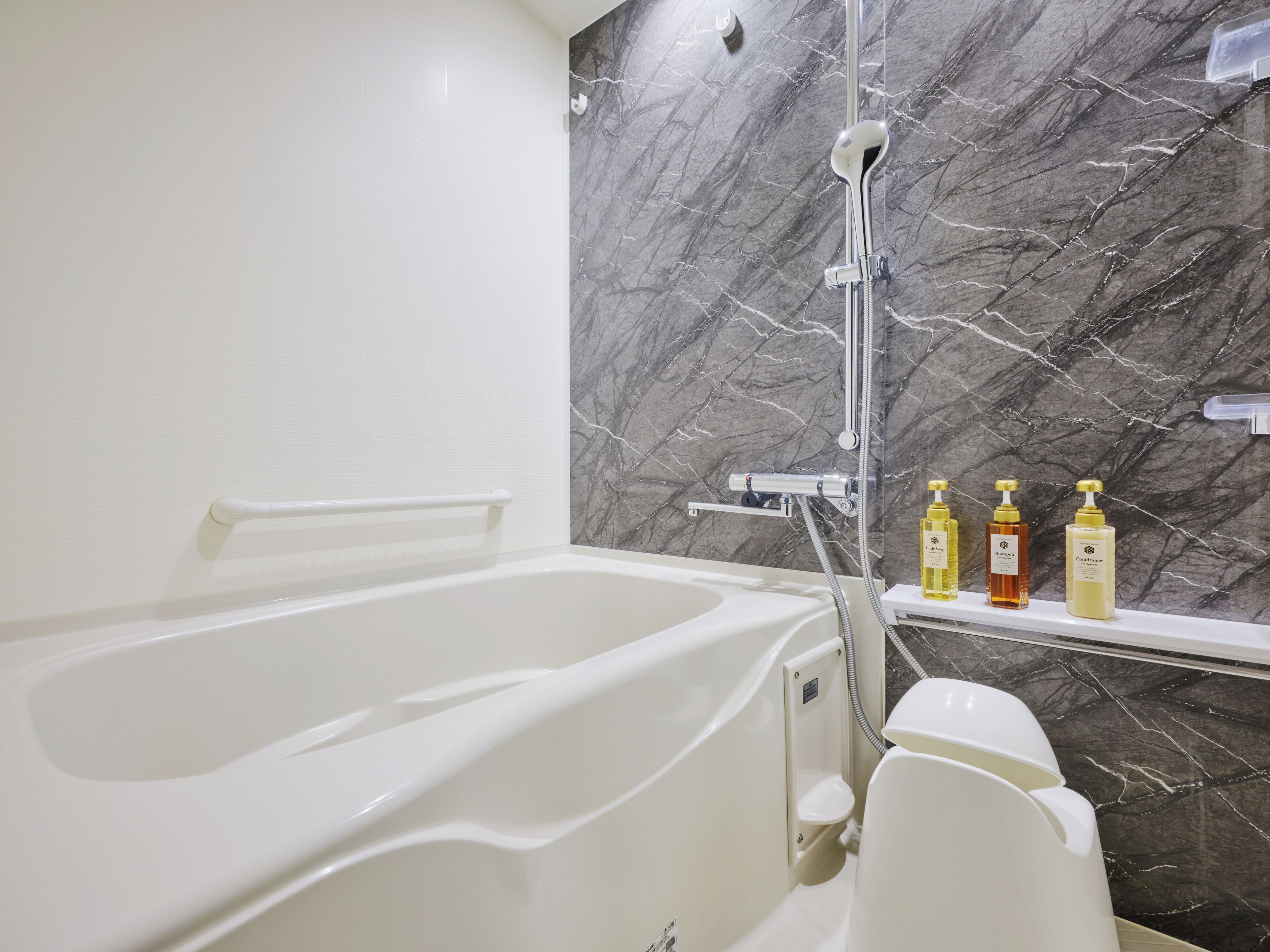 Separate tub and shower, hair dryer, slippers, electronic bidet