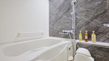 Separate tub and shower, hair dryer, slippers, electronic bidet