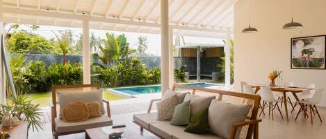 Design Villa | Living area | 20-inch LED TV with cable channels, TV, Netflix