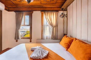 Deluxe Room, Partial Sea View | Iron/ironing board, cots/infant beds, free WiFi, bed sheets