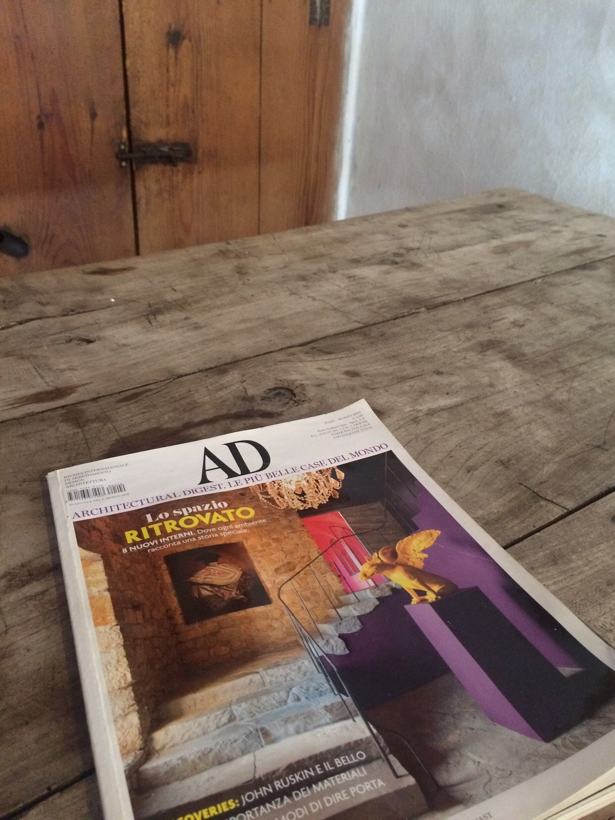 A magazine on a wooden table.