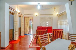 Enjoy meals in this cozy dining area with a central table and four comfortable chairs.