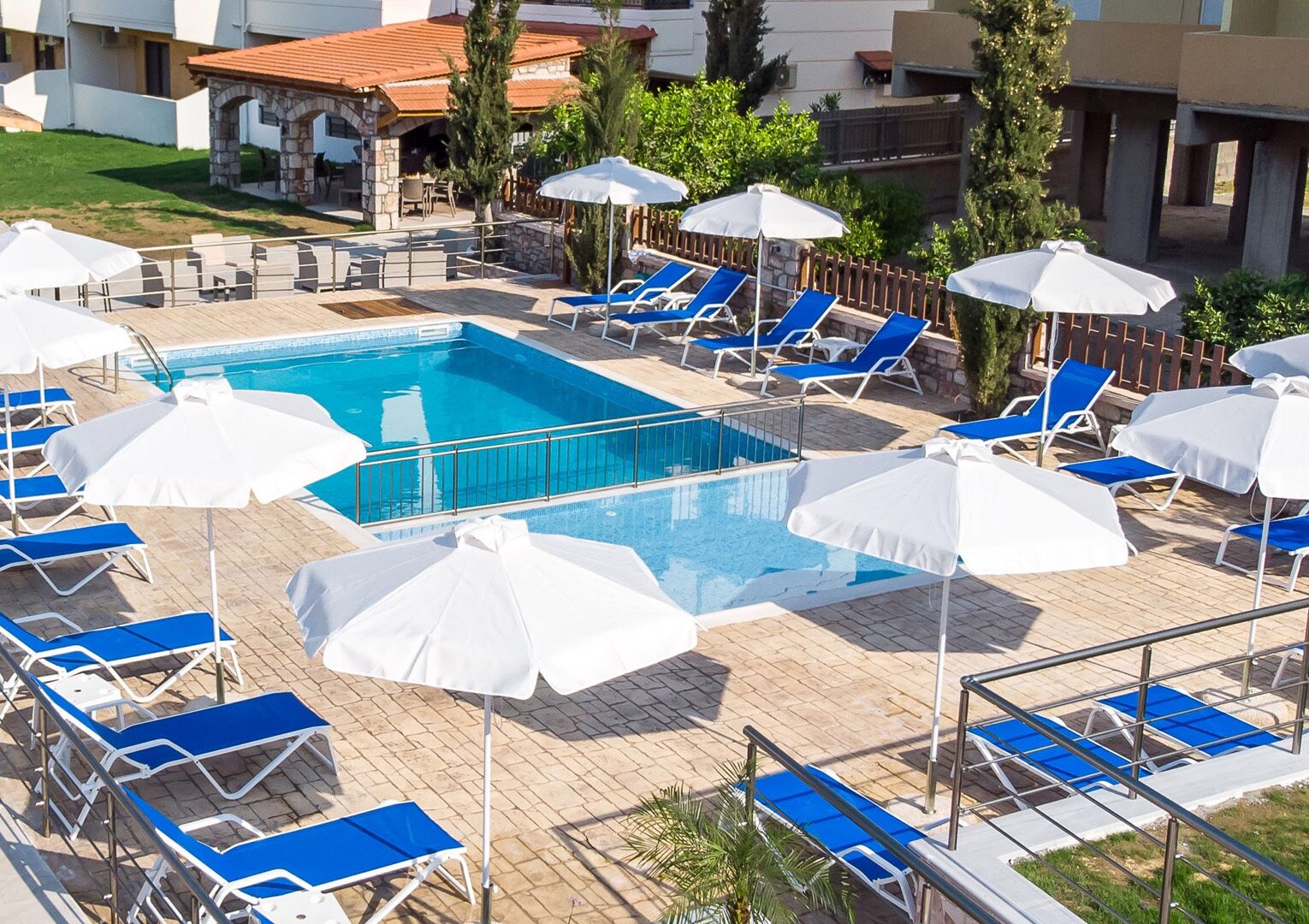Seasonal outdoor pool, open 10:00 AM to 7:00 PM, pool umbrellas
