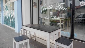 A cafe named "Double Tree" with outdoor seating. - Urbanview Hotel Double Tree Purwokerto (Purwokerto)