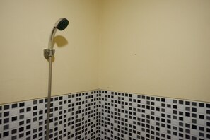 Double Room (RedDoorz) | Bathroom | Shower, free toiletries, towels - RedDoorz near GOR Wisanggeni (Tegal)