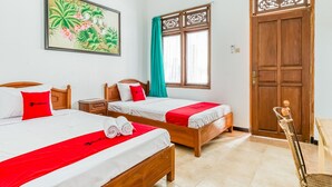 A hotel room with two beds, a wooden door, a window with a curtain, and a wall-mounted painting. - RedDoorz Syariah near Gor Ken Arok (Malang)