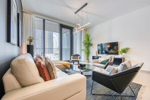 Premium Apartment, 2 Bedrooms, Non Smoking, City View | Living area | 50-inch Smart TV with cable channels, TV, streaming services - EDEN'S Homes & Villas - BLVD Heights (Dubai)