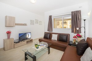 Apartment, 3 Bedrooms, Terrace | Living area | 40-inch LED TV with satellite channels, TV - Summer Breeze Maisonette with Terrace by Getaways Malta (Mellieha)