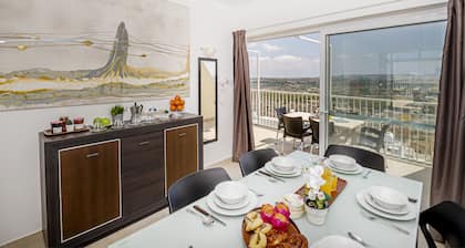 Summer Breeze Penthouse with large Terrace and Hot Tub by Getaways Malta