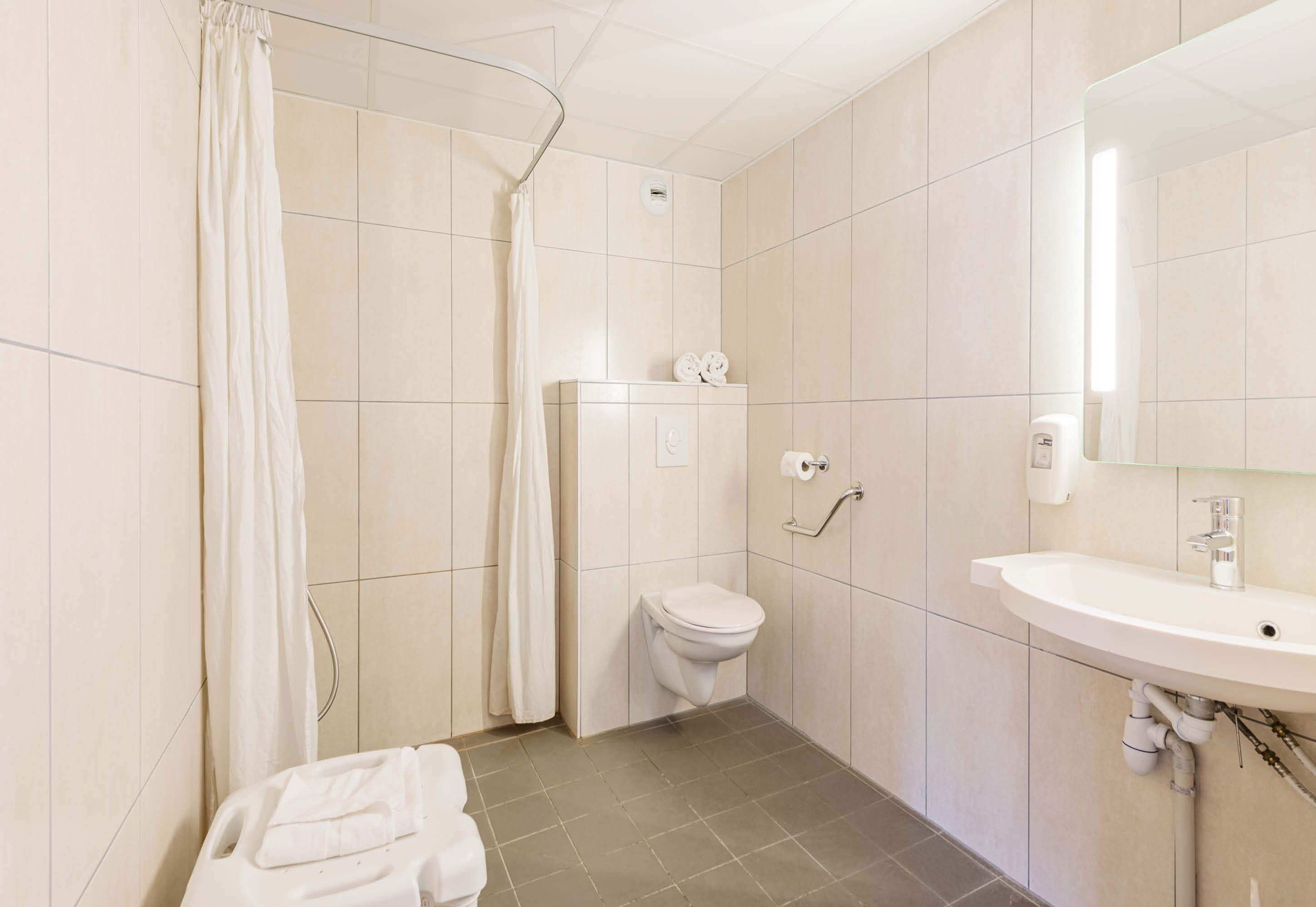 double room, mobility accessible | bathroom | shower, hair dryer, towels, soap