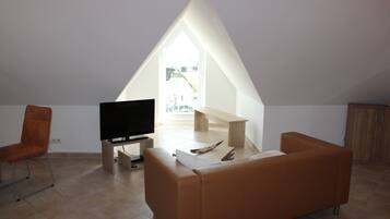 Apartment, Balcony (final cleaning fee incl.) | Living area | 65-inch flat-screen TV with satellite channels, TV