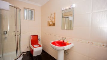 Shower, free toiletries, hair dryer, slippers