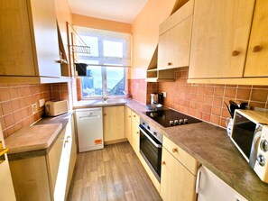 Fridge, microwave, oven, dishwasher - A  2-bedroom seafront apartment in a large detached property on seafront (Woolacombe)