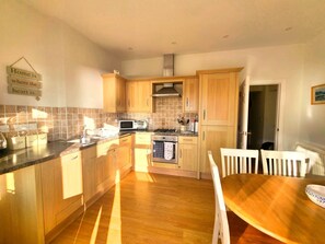 Fridge, microwave, oven, cookware/dishes/utensils