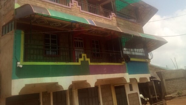 A multi-story building with balconies and a flat roof. - Rama Restaurant (Nairobi)