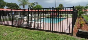 Outdoor pool - Travelers Inn (Okeechobee)