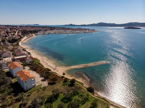 Experience the charm of a Mediterranean coastal town with a bustling marina and scenic beachfront.