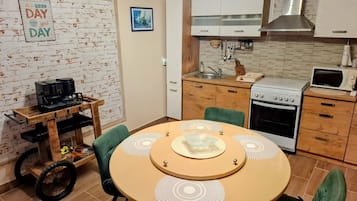 Apartment (A1) | Private kitchen | Fridge, microwave, stovetop, coffee/tea maker