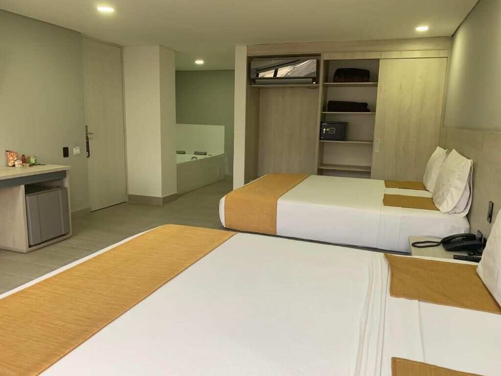 superior room, 2 queen beds, hot tub | minibar, free wifi