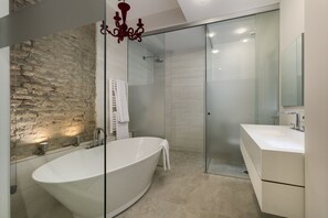 Bathtub, hair dryer, towels, soap