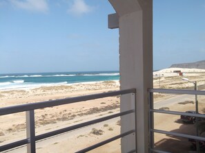 Enjoy breathtaking views of the ocean from this beachfront balcony.