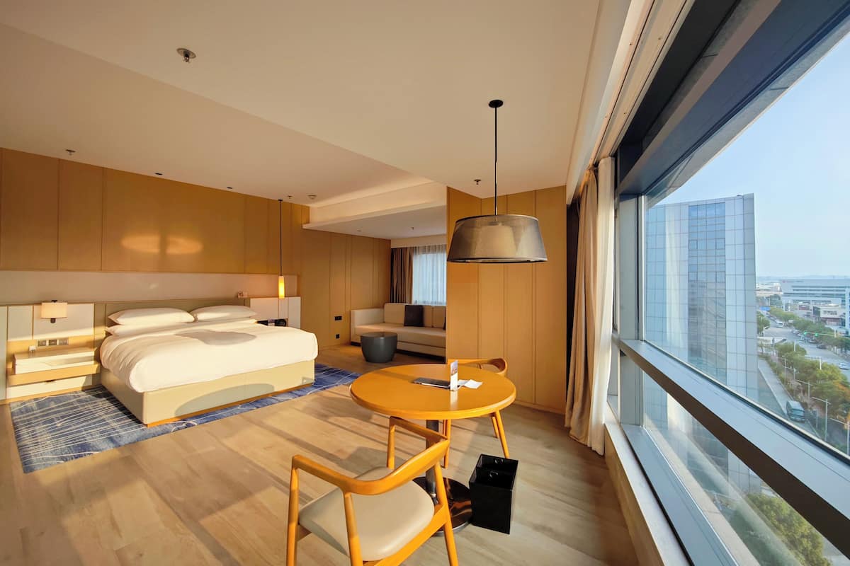 premier room, 1 king bed, city view | 1 bedroom, minibar, laptop workspace, iron/ironing board