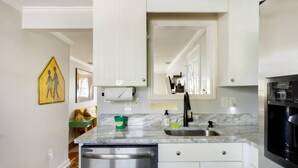 Private kitchen - Vibrant, Colorful Condo Building With Backyard Firepit and Games (Savannah)