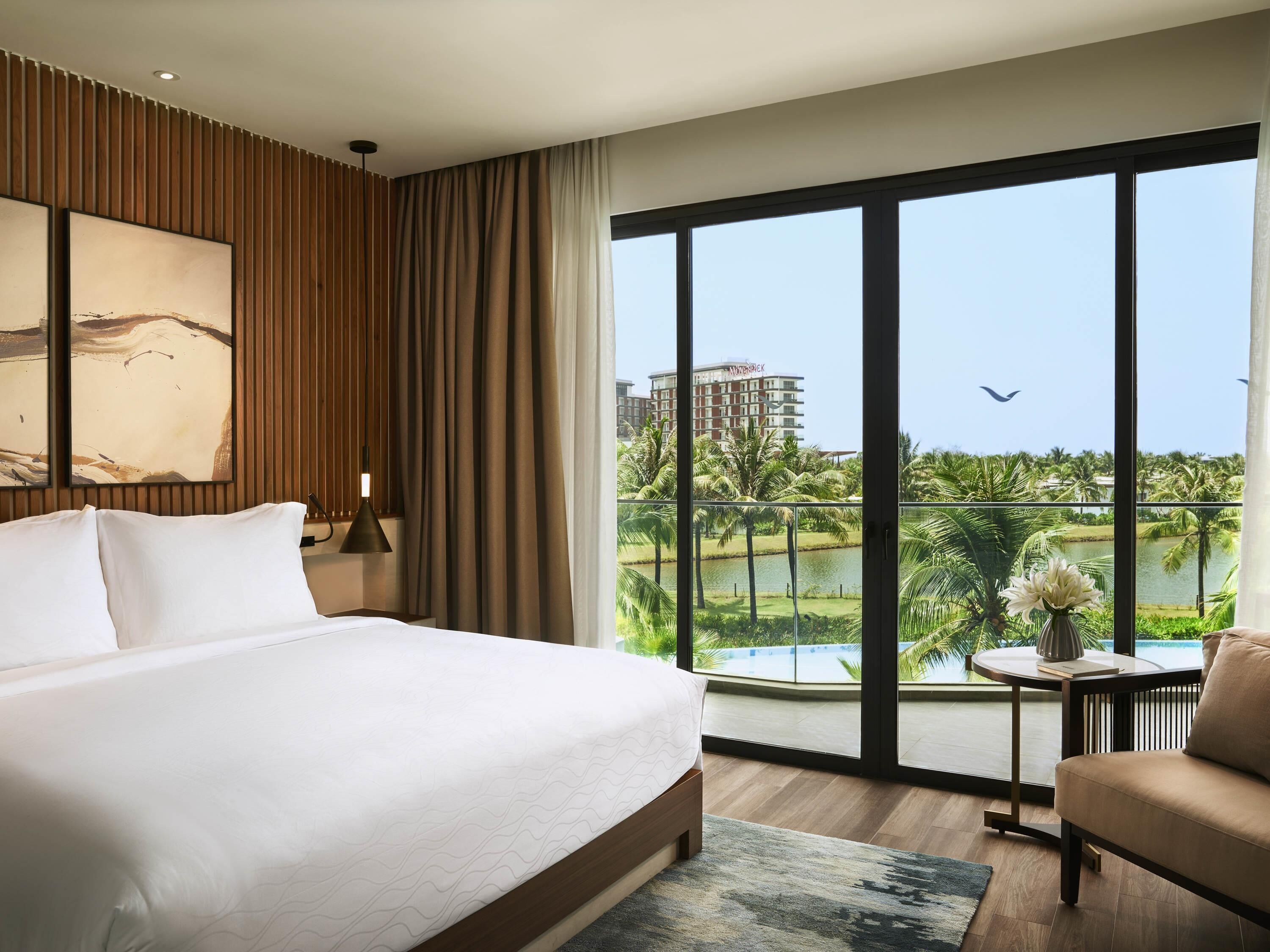 Studio, 1 King Bed, Balcony, Pool View | Minibar, in-room safe, individually decorated, individually furnished