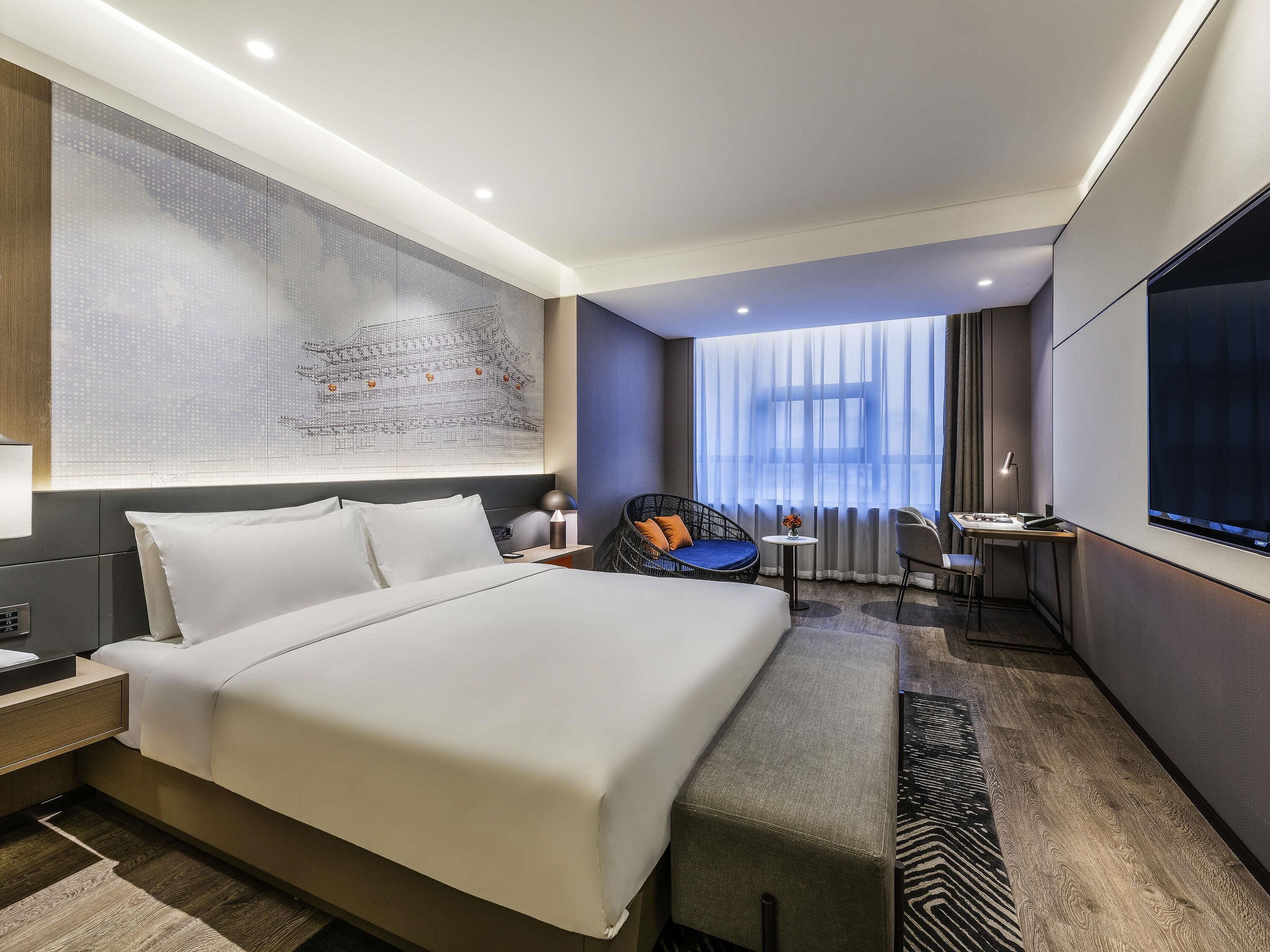 Quarto superior, 1 cama King | Edredons de pluma, frigobar, cofres nos quartos, cortinas blackout