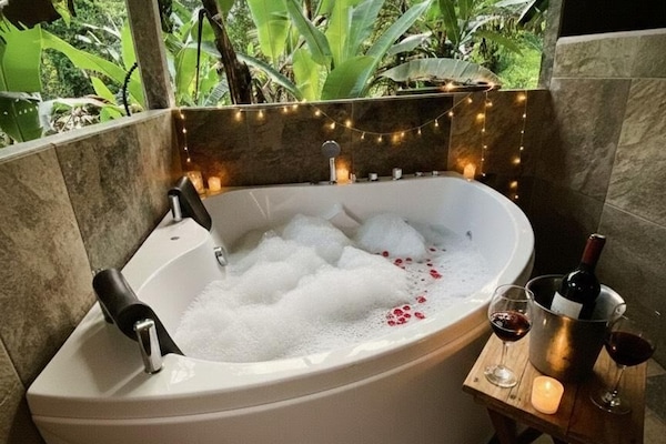 Honeymoon Cabin, 1 Double Bed, Jetted Tub, Mountain View | Bathroom | Shower, hydromassage showerhead, free toiletries, towels