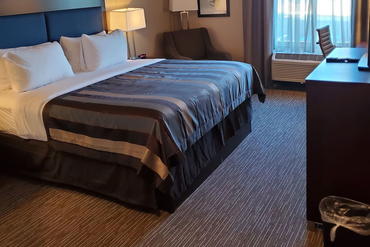 Desk, laptop workspace, blackout curtains, iron/ironing board