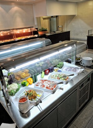 A buffet with various food items and a salad bar. - Hotel Tara (Bečići)