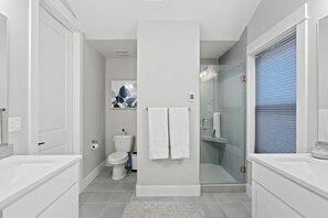 Shower, hair dryer, towels, soap
